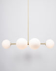 Six Matte Sphere Articulating Satin Brass Pendant